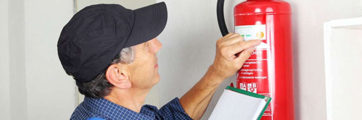 inspecting a fire extinguisher